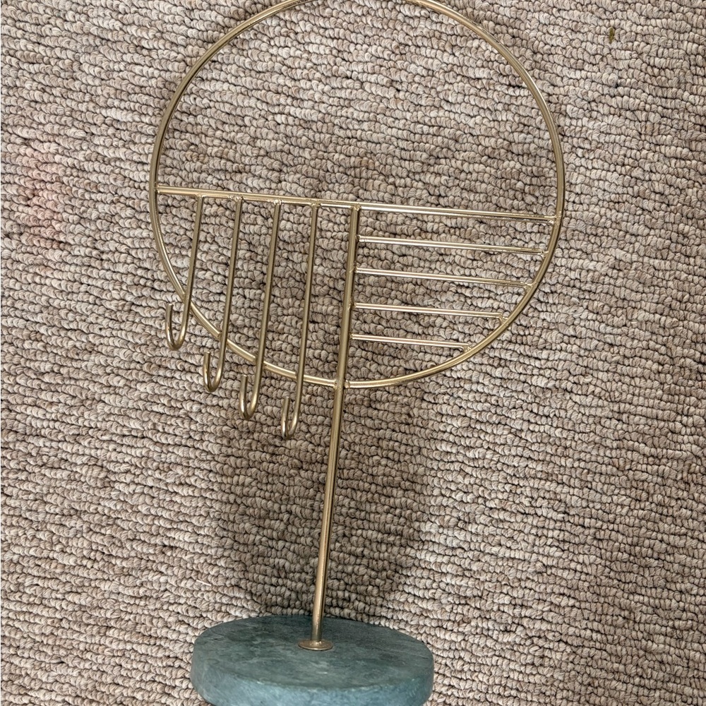 Gold Metal Circular Jewelry Stand with Green Stone Base